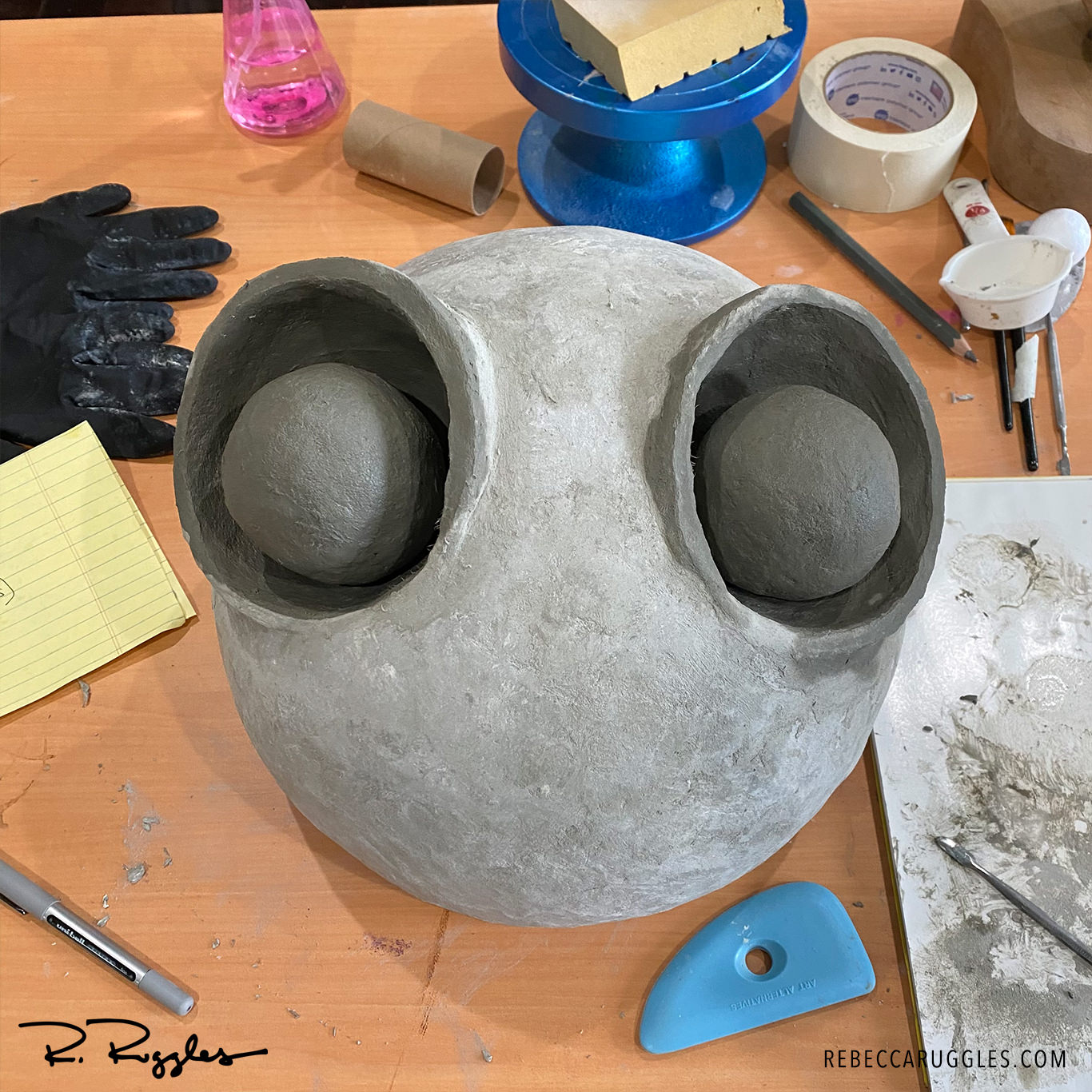 Sculpting eyes with 3" foam balls and concrete paper clay.
