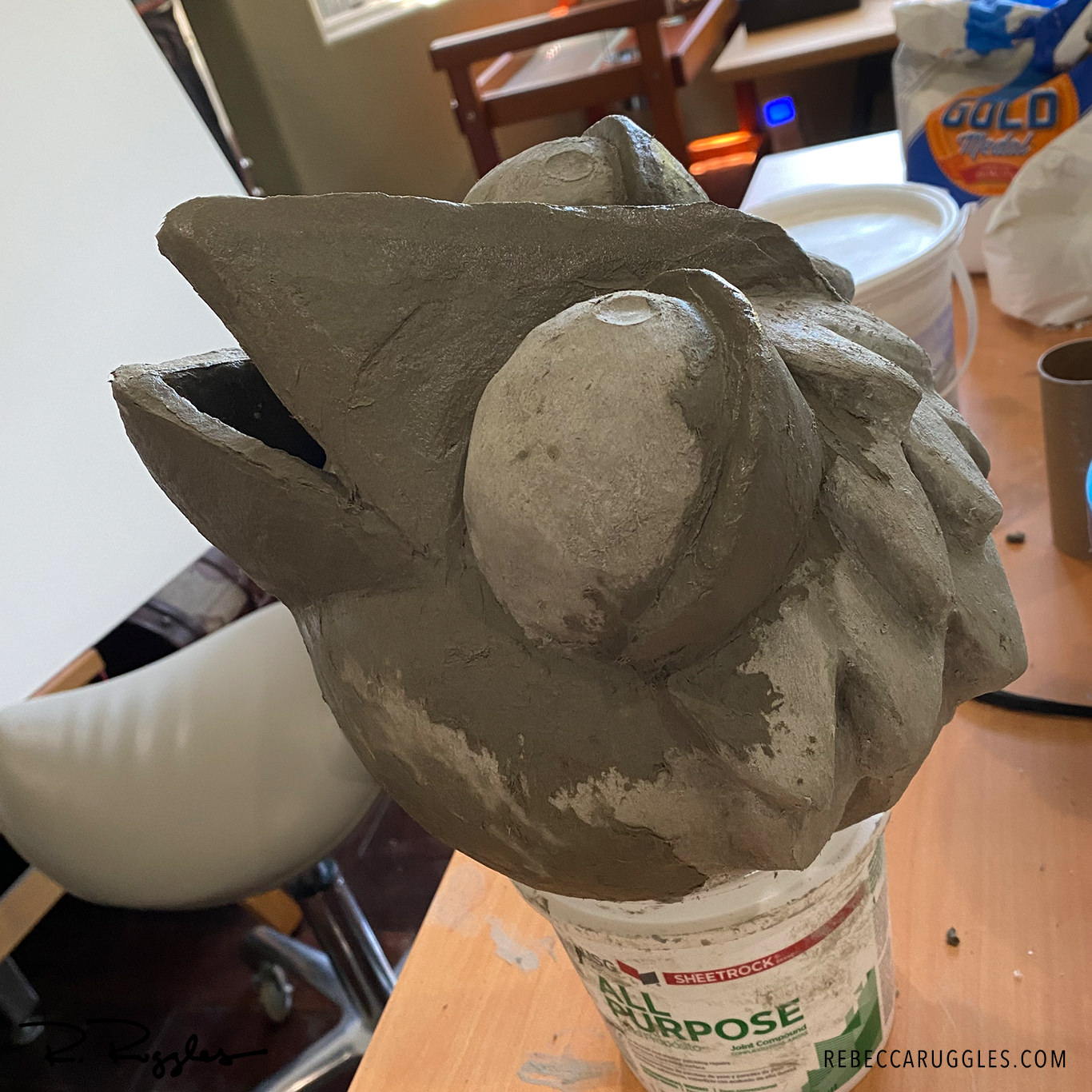Coating the beak inside and out with concrete paper clay.