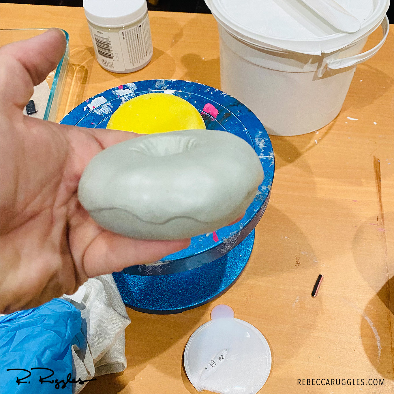 Sculpting the frosted doughnut.