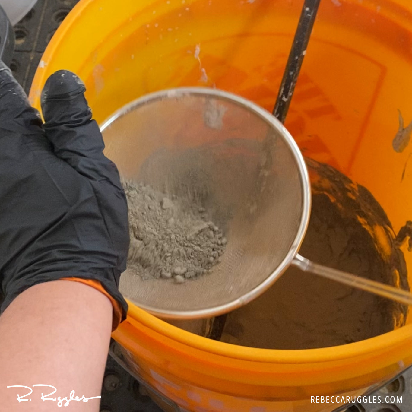 Sifting Portland cement to remove clumps in the clay.