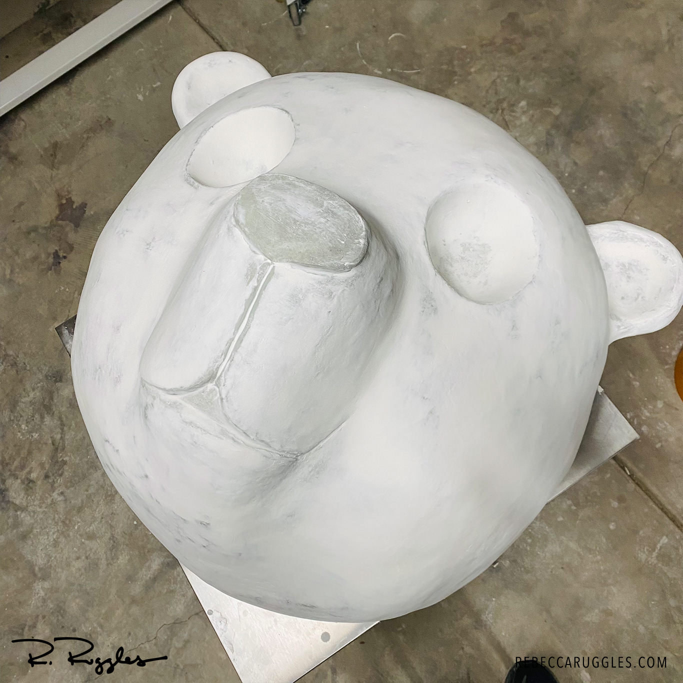 First layer of joint compound on the giant panda sculpture, more layers to go.