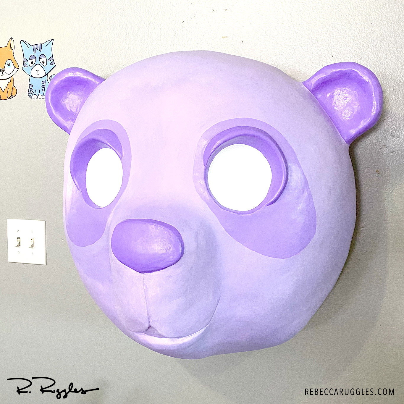 Giant panda sculpture being painted with shades of purple acrylic paint.
