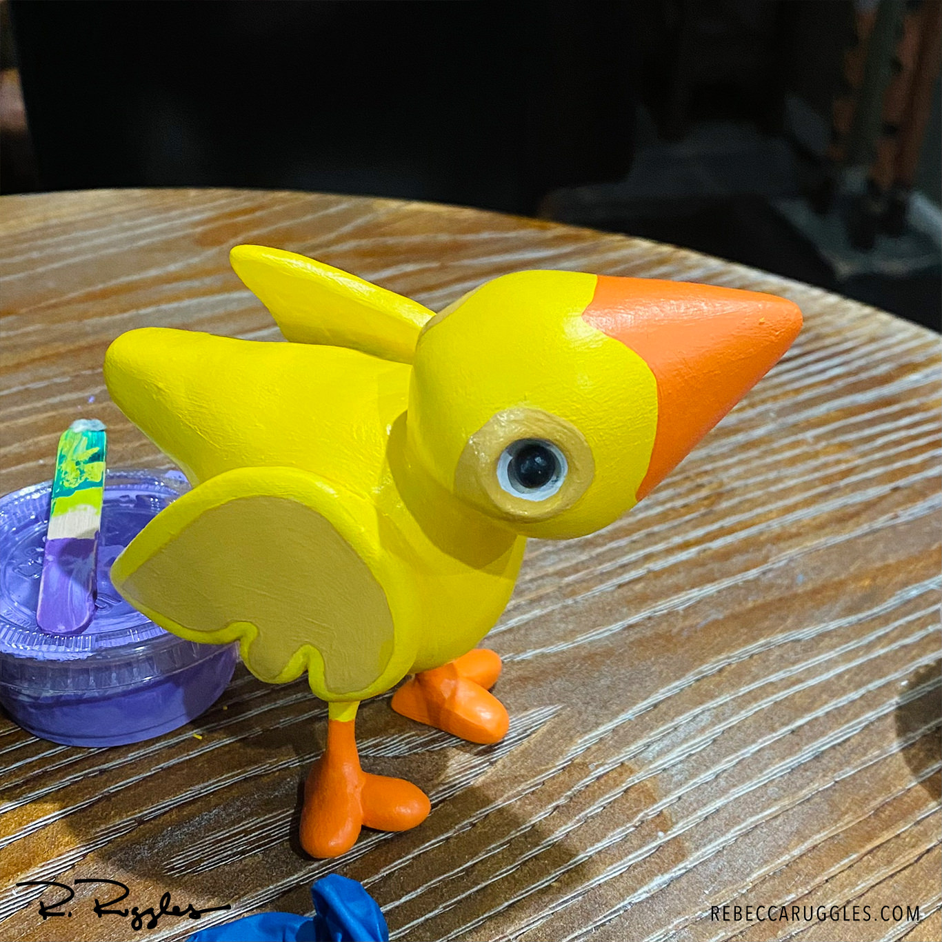 Little yellow bird sculpture by Rebecca Ruggles.