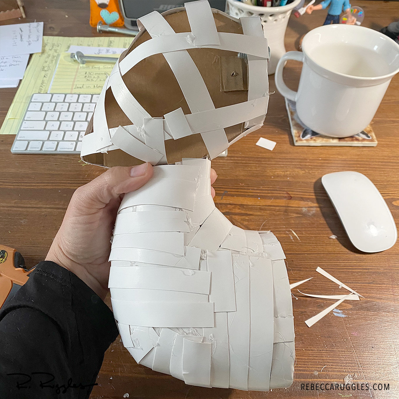 Side view of the early bird armature built out of cardboard by artist Rebecca Ruggles.