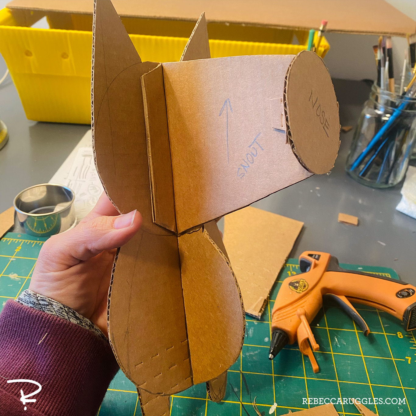 Cardboard profiles glued together to form the basic shape of the sculpture.